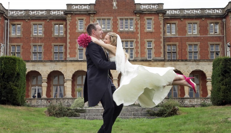 Bride leaping into the grooms arms